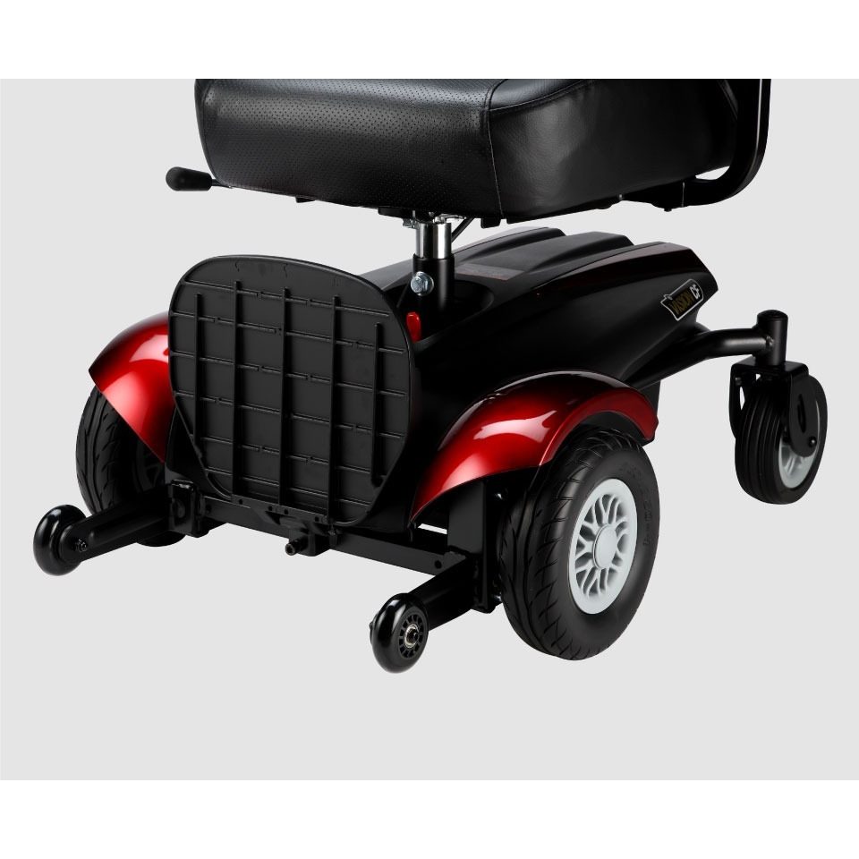 Close-up front side view of the lower part of the Merits Vision CF 3 wheelchair, displaying the wheels and footrest, highlighting the quality construction and ergonomic design