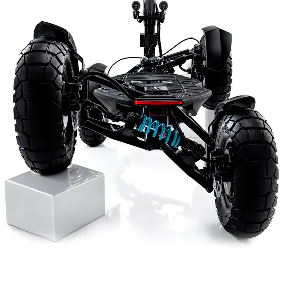 Close up rear view of the MIA Four X2 suspension and large rugged tires on a white background