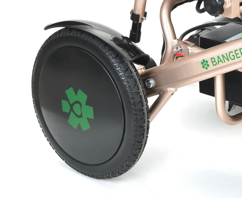 Rear wheel with green Bangeran logo on Pegasus Cerebral Palsy folding wheelchair.