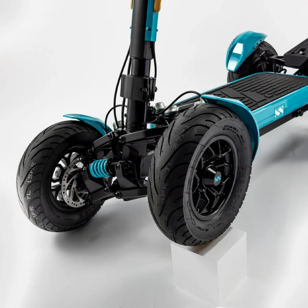 Front suspension and wide tires of MIA SPYQE GT 2x4 electric scooter built for stable and smooth riding