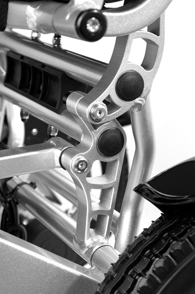 Porto Mobility Ranger Discovery XXL folding power wheelchair, folding frame joint close up in black and white