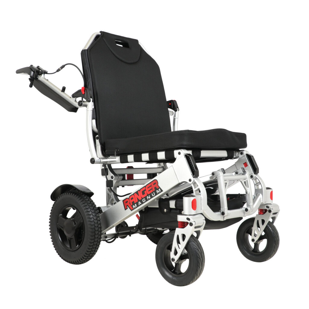 Porto Mobility Ranger Magnum folding power wheelchair with controller armrest swung back, angled front view